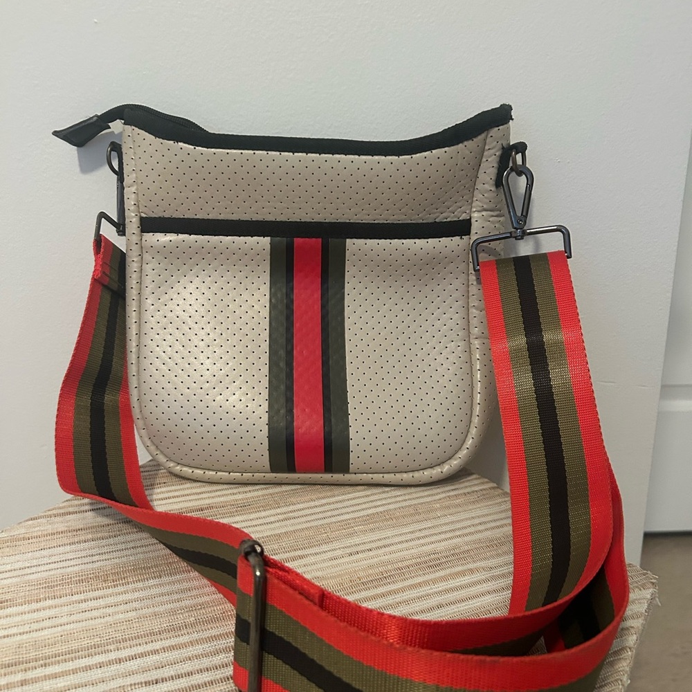 HAUTE SHORE Beige Crossbody with Red and Black Accents